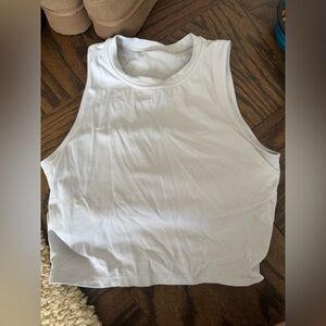 White athletic top with built in sports bra - one size. In black as well